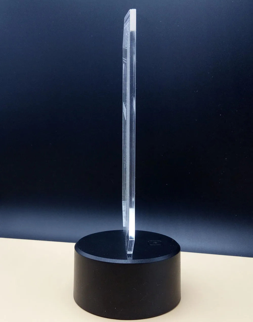 3D rose-shaped LED night light showing colour-changing glow on acrylic panel with ABS base.