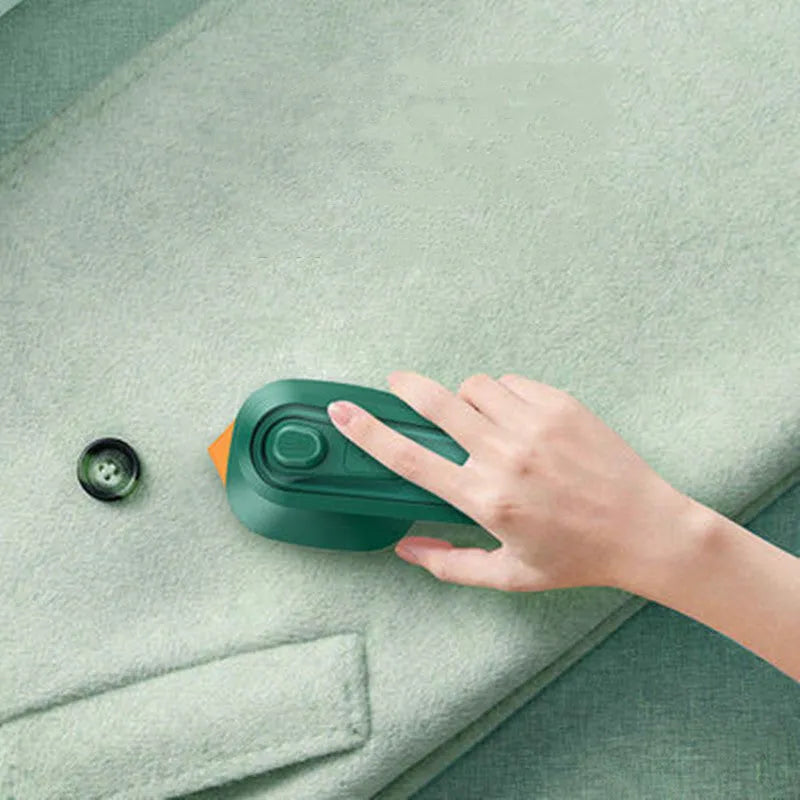 Dark green portable hanging steam iron with ceramic panel, compact design for travel garment care