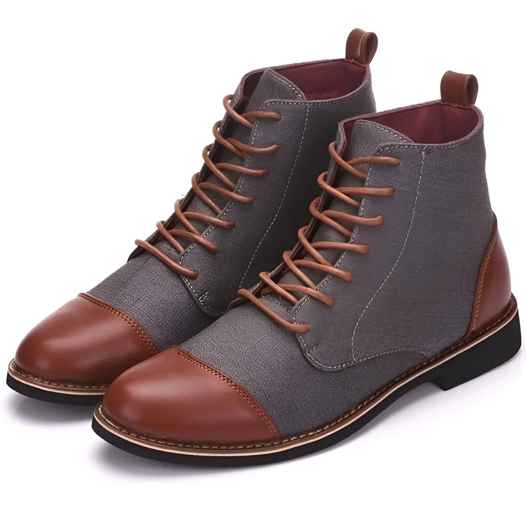 Men's black leather boots with metal belt buckle details and a rubber sole.