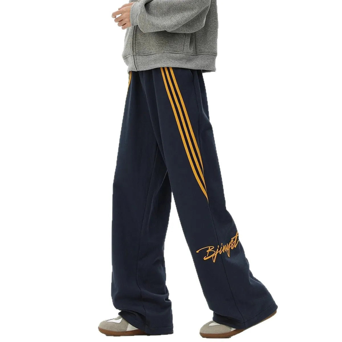 Men's striped loose straight-leg casual pants in Black, front view, showing wrinkle-free fabric and straight leg cut