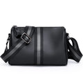 Black genuine leather crossbody bag showing single shoulder strap and structured 24x16x13cm design.