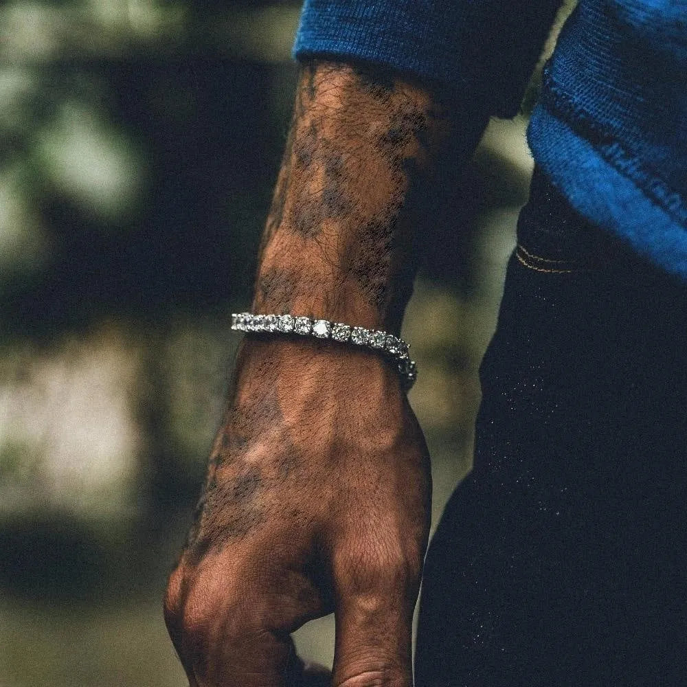 Men's silver geometric charm bracelet with a single row of sparkling clear rhinestones on a link chain.