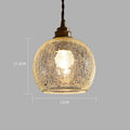 Retro-style brass and glass ball chandelier ceiling light with copper body and spherical shades.