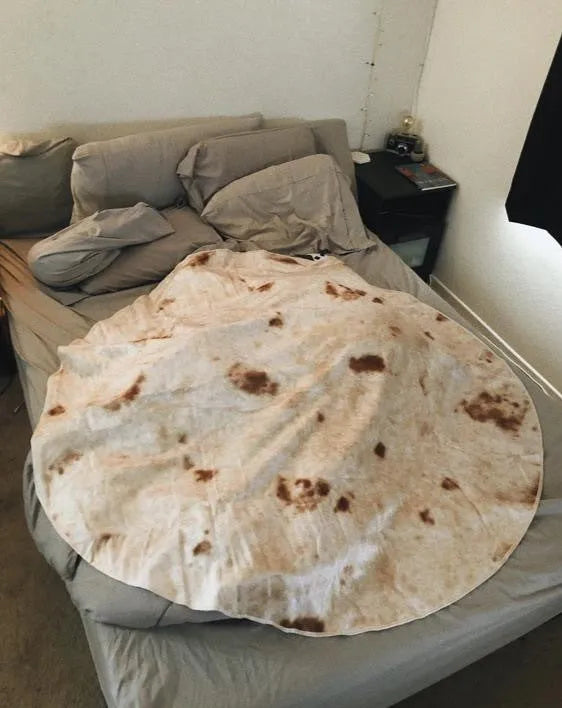 Round flannel burrito blanket with food-themed printing, shown in coral fleece fabric.