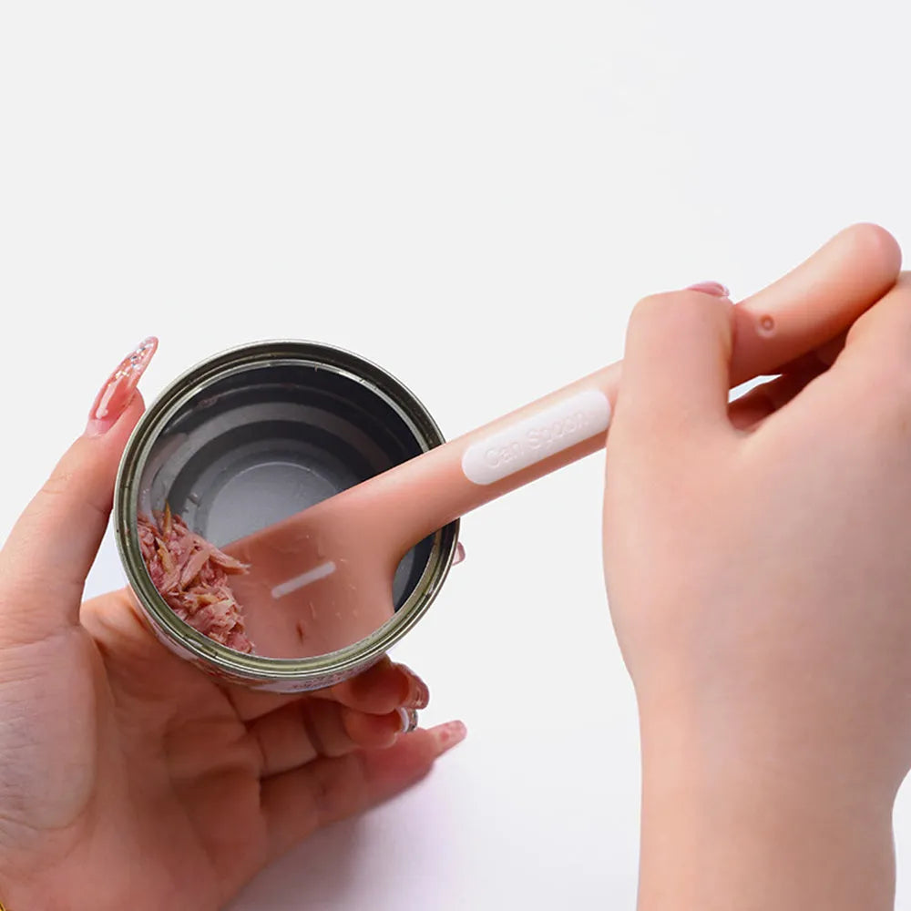 Green long-handled pet food spoon with right-angle head for scraping canned wet food.