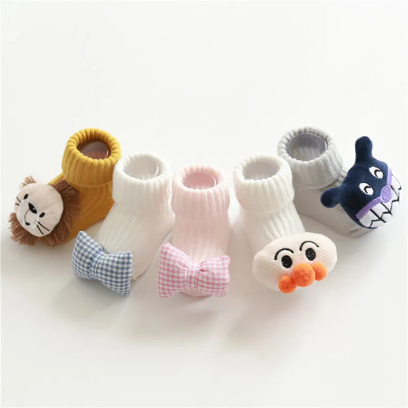 Cotton baby floor socks in various colours and patterns including bows, stars, and animal designs