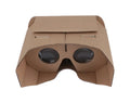 Corrugated paper virtual reality glasses headset for smartphones on a table.