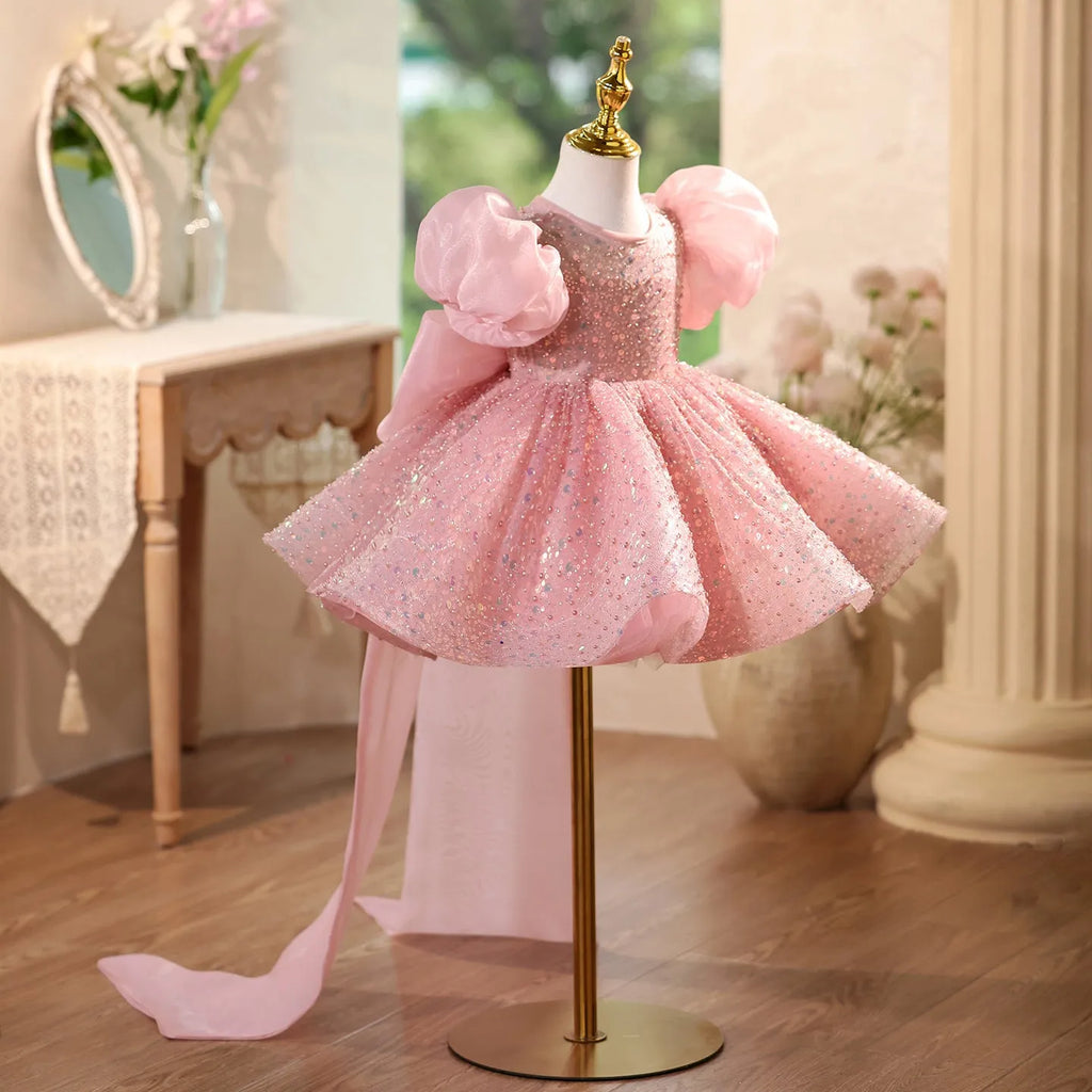 Children's sequined formal dress in pink with puff sleeves and princess-style silhouette for weddings and parties