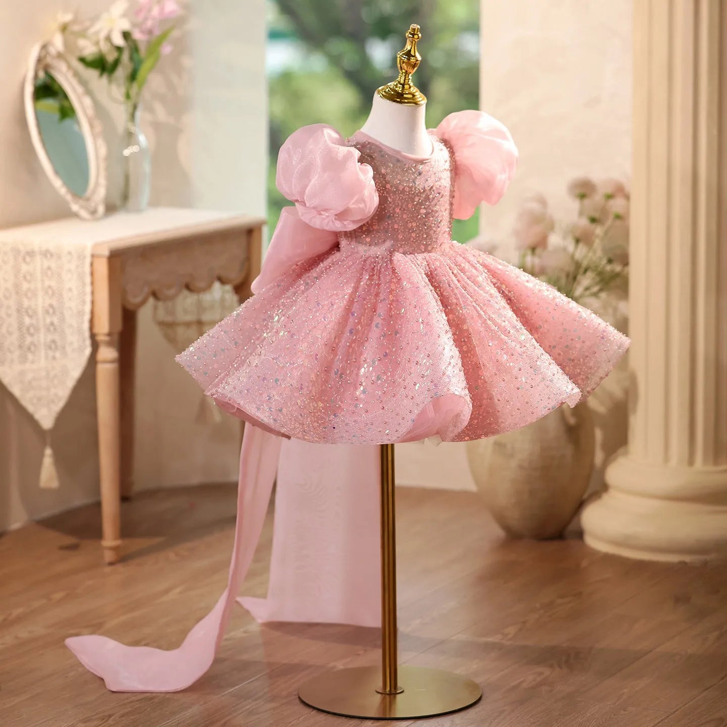 Children's sequined formal dress in pink with puff sleeves and princess-style silhouette for weddings and parties