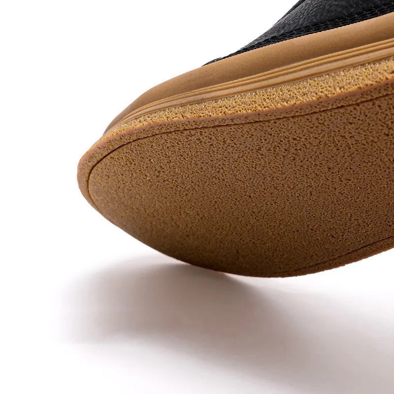 Men's black casual leather shoes with round toe, flat heel, and lace closure on a white background