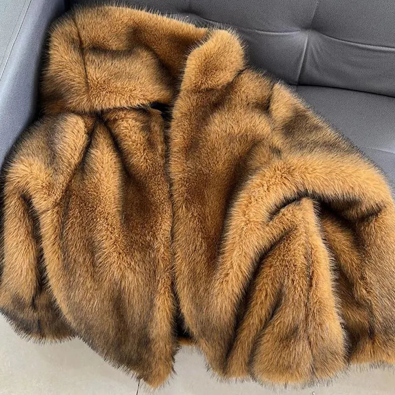 Silver grey loose-fit mid-length faux fur coat for women on a hanger
