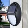 Black rectangular solar wall light with solar panel and LED illumination