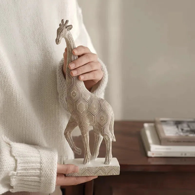 Wood colour synthetic resin giraffe decorative figure ornament on a shelf.