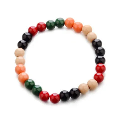 Natural stone beaded bracelet with lava stones for essential oils on a wrist.