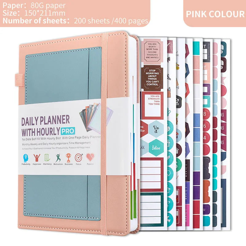 A5 undated notebook with PU leather cover in six colours, open to show flat-lay binding and planning stickers.