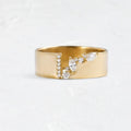 Gold electroplated women's ring with shining zircon stones on a copper band.
