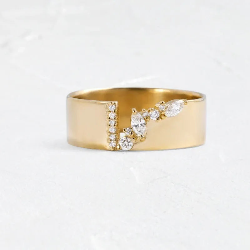 Gold electroplated women's ring with shining zircon stones on a copper band.