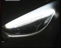Slim silicone car LED daytime running light strip with flowing turn signal effect on a vehicle headlight.