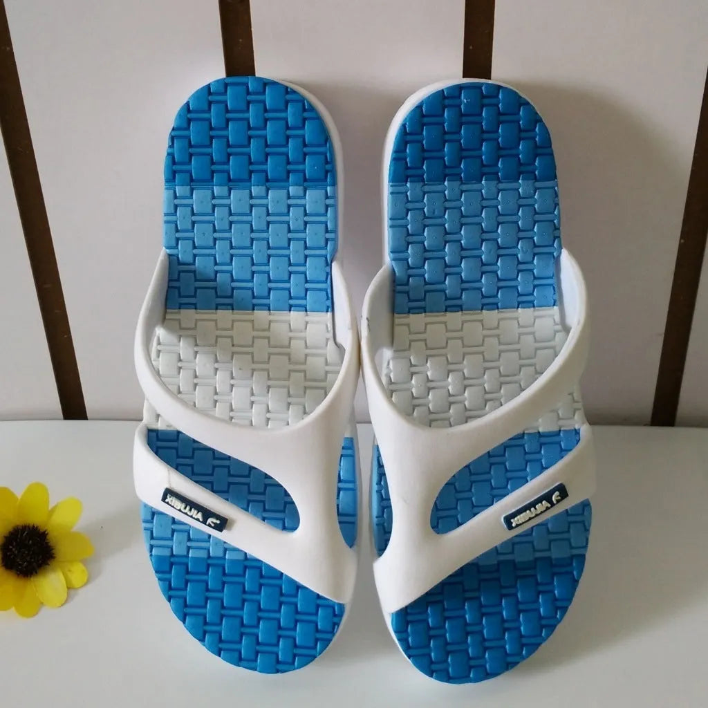 Men's blue summer home slippers with open toe and cotton-linen style upper on a balcony floor