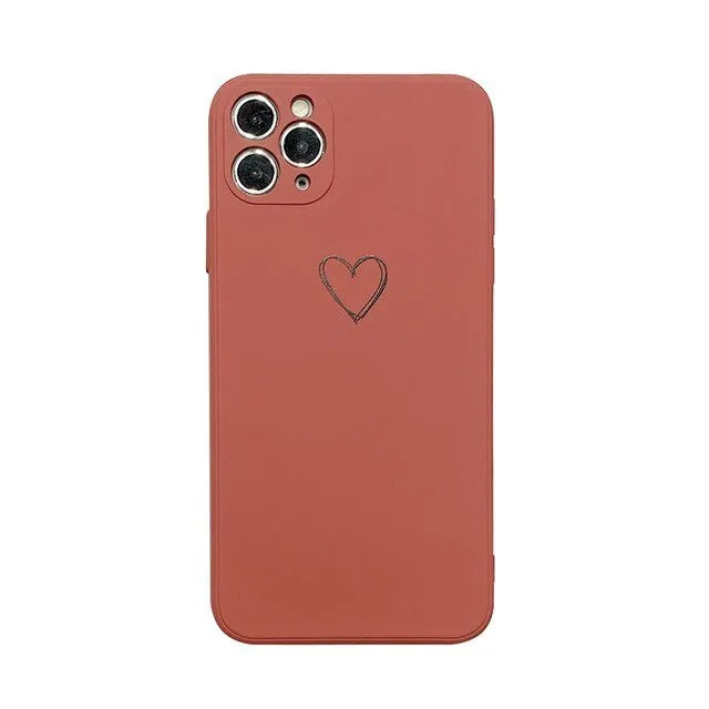 Solid colour silicone TPU back cover case for Apple iPhone on a table, showing colour options.