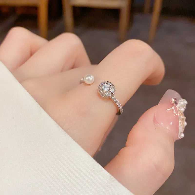 Geometric open-end ring with round zircon accents in gold or silver finish