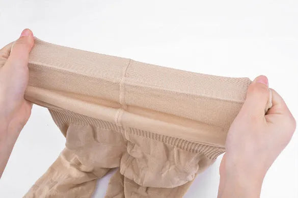 Black seamless high-waist shapewear shorts for women laid flat.