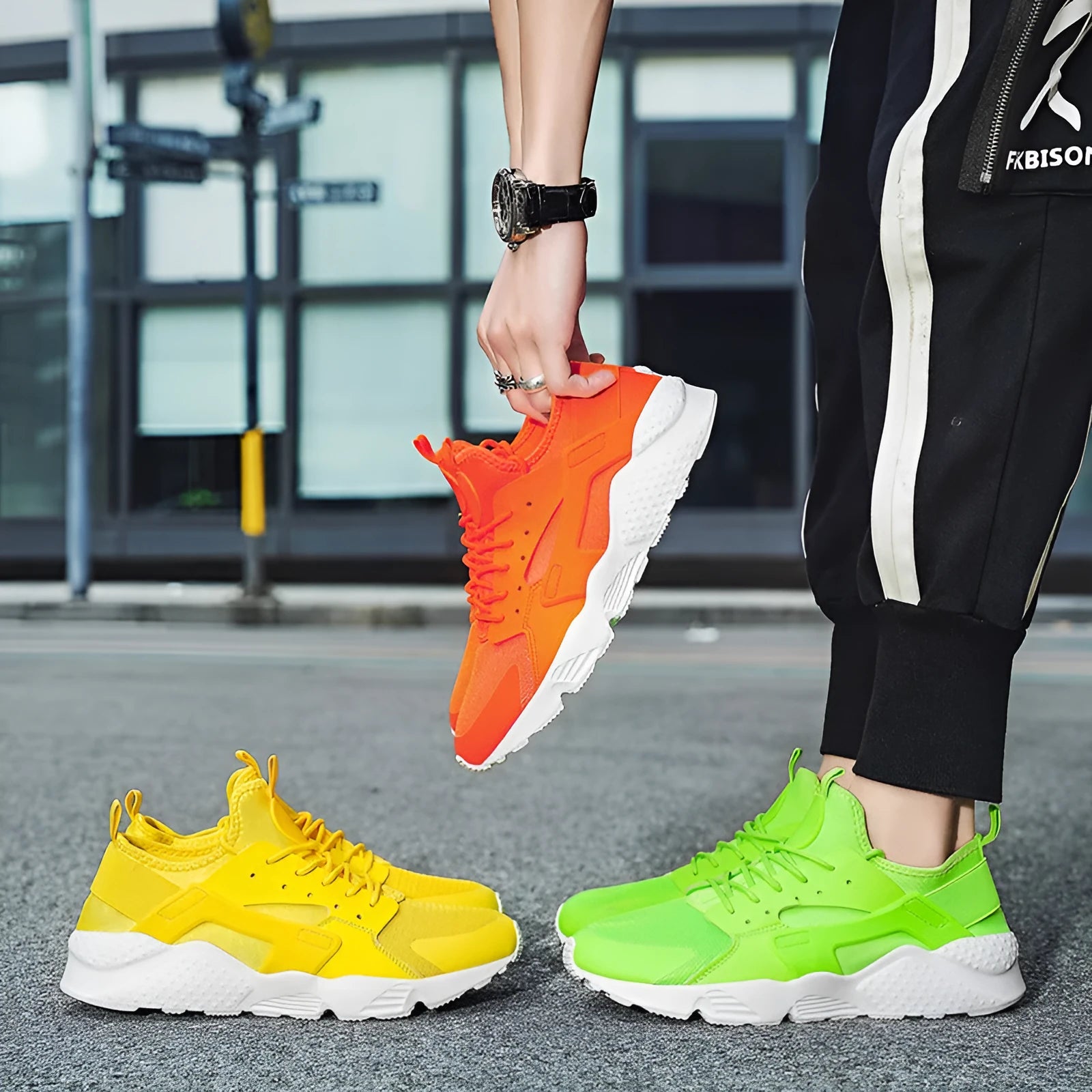 Men's casual low top shoes with mesh upper in fluorescent red colour showing round toe and lace-up design