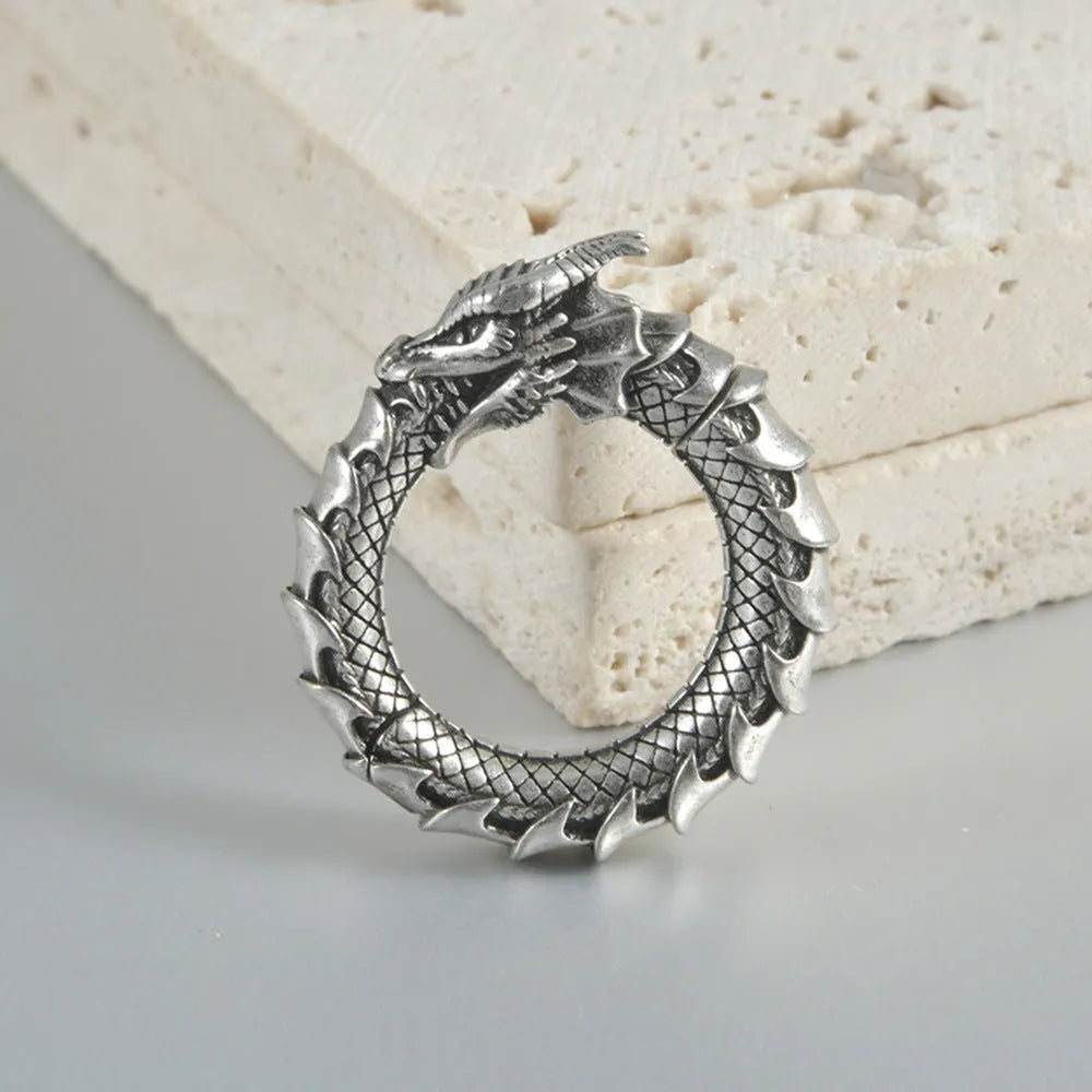 Pair of large stainless steel geometric dragon earrings with antique silver finish and alloy fittings.