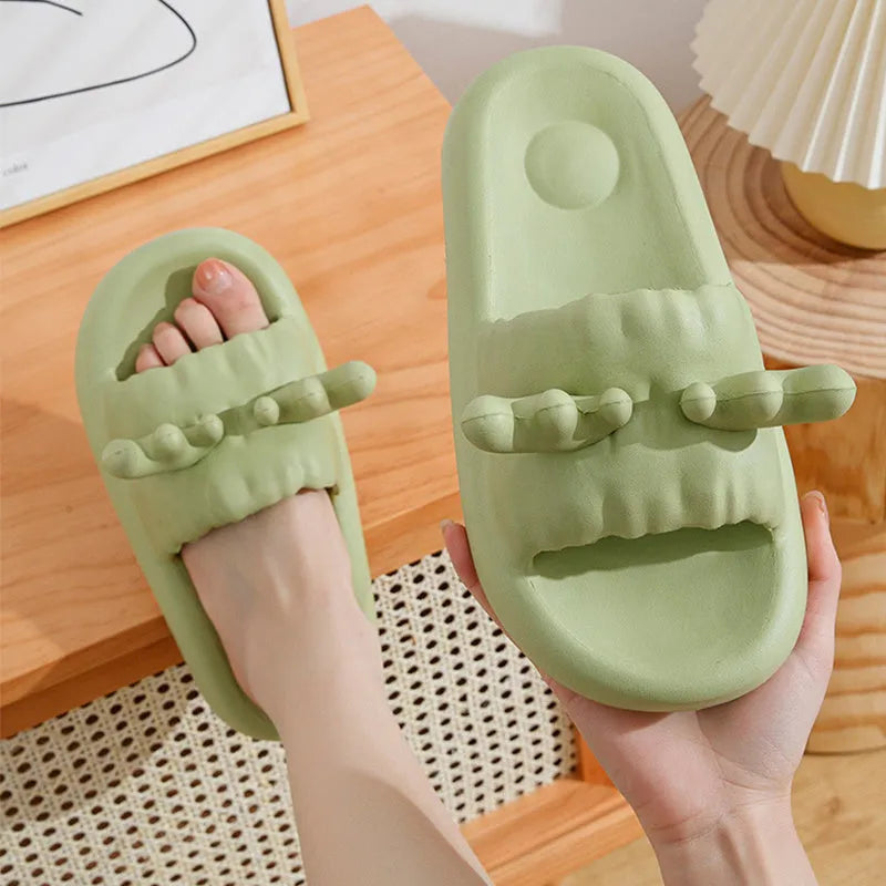 White deer horn pattern EVA flip-flop slippers with hollow-out design on a bathroom floor