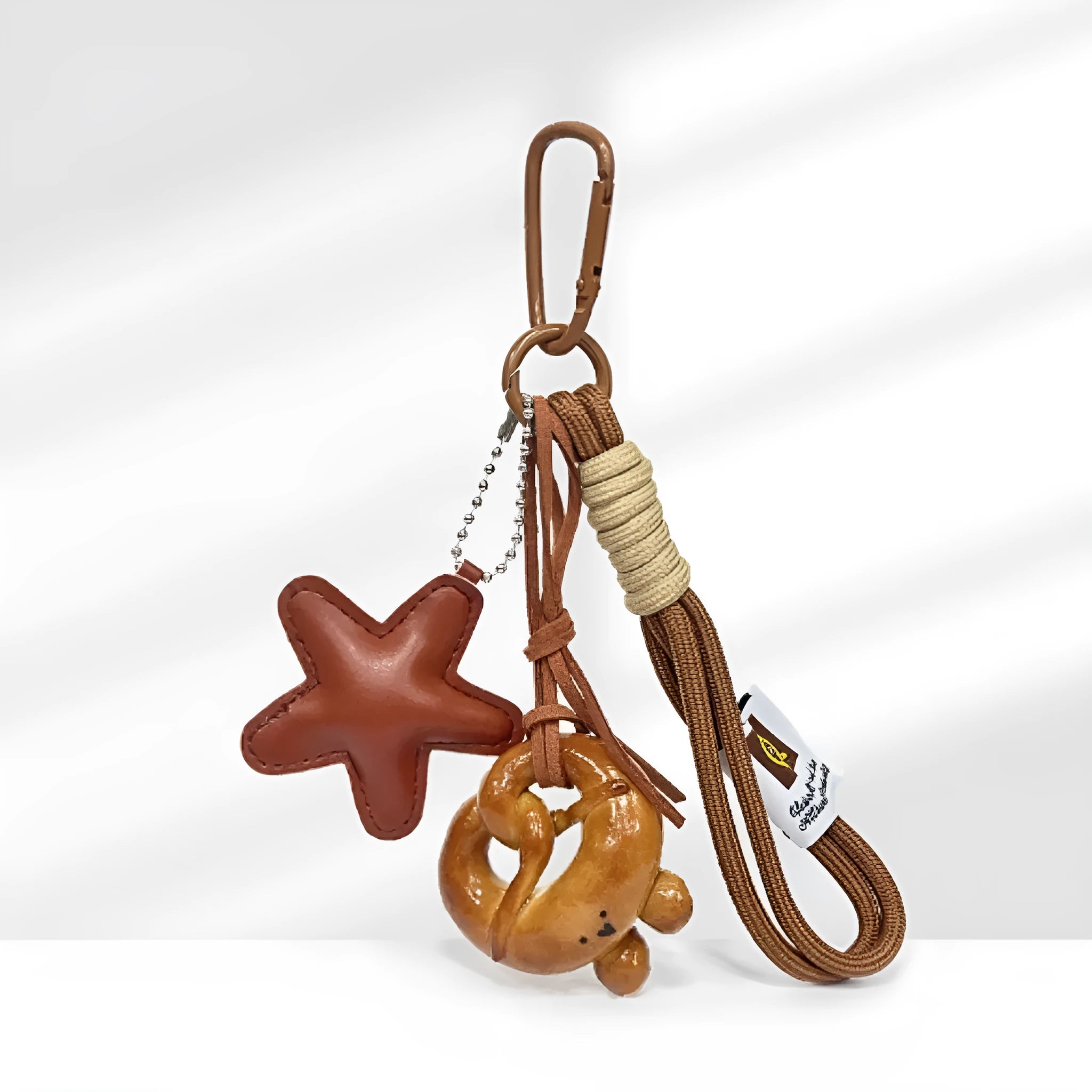 Handmade soda bread design handbag pendant with brown star carrying strap and baking varnish finish