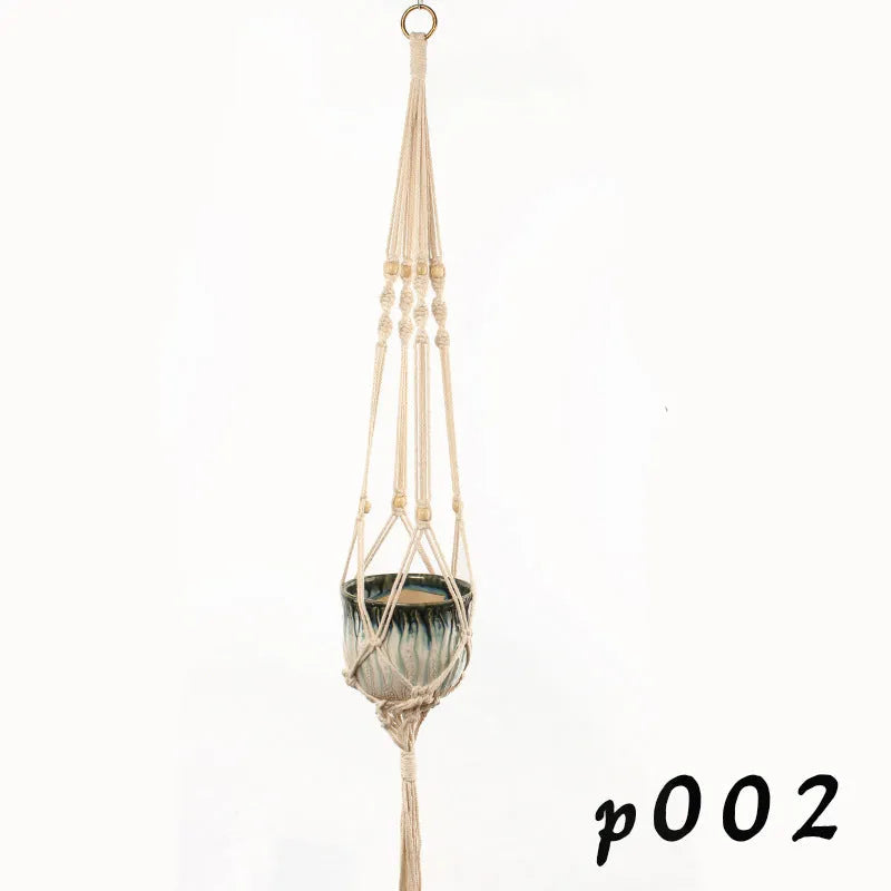 Natural cotton rope woven wire plant basket in a rustic style, shown holding a small potted plant.