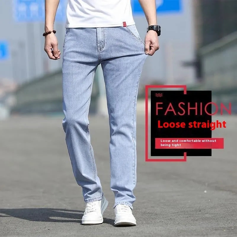 Man wearing smoky grey straight leg jeans with low waist and zipper fly.