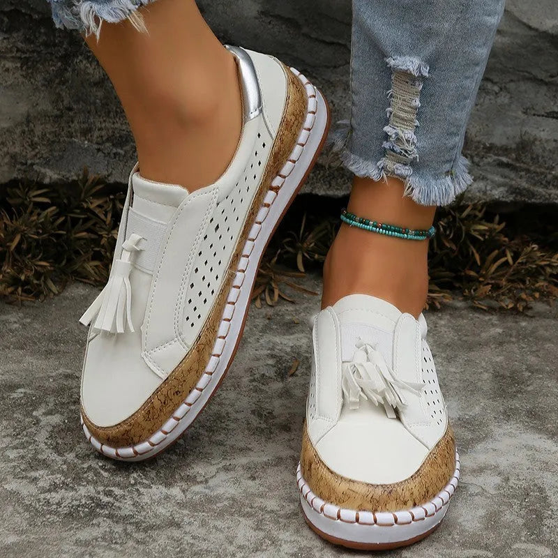 Women's casual tassel loafers with low heel, patent leather finish, round toe, and slip-on style in multiple colours