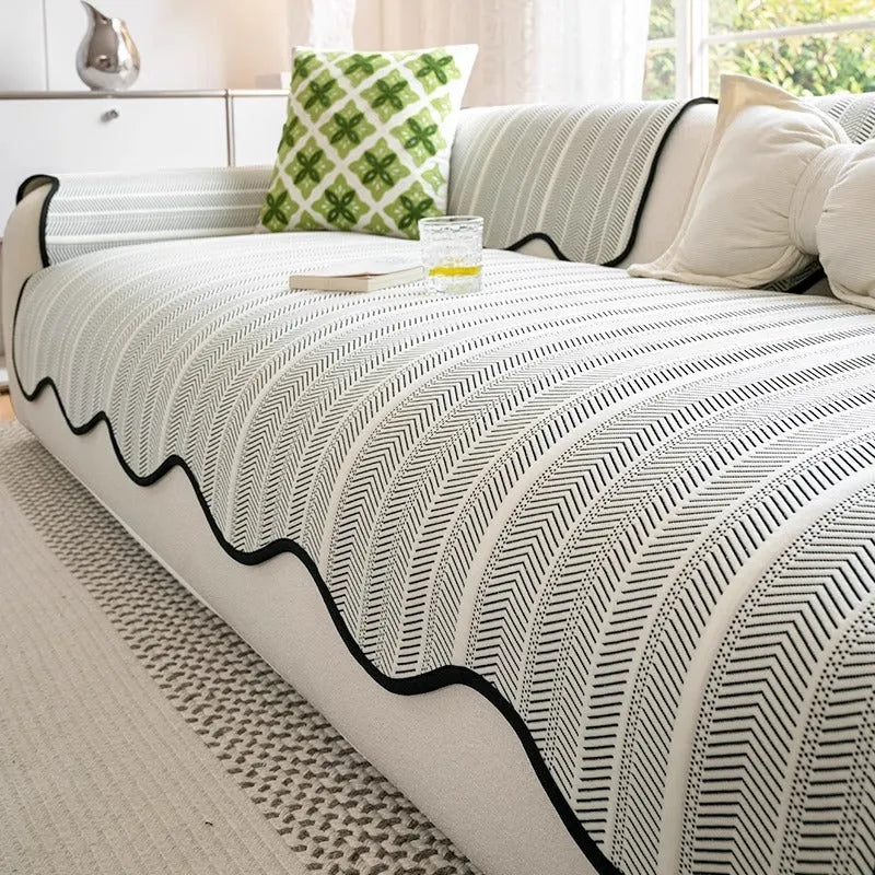 Ice silk fixed non-slip sofa cover in a special pattern, shown in jelly green colour on a couch.