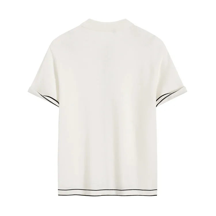 White women's short-sleeve cardigan with contrasting colour lapels laid flat.