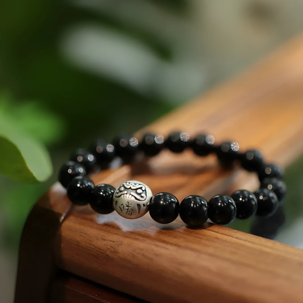 Black agate bracelet with 10mm beads, sterling silver components, and Chinese style design