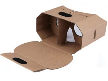 Corrugated paper virtual reality glasses headset for smartphones on a table.