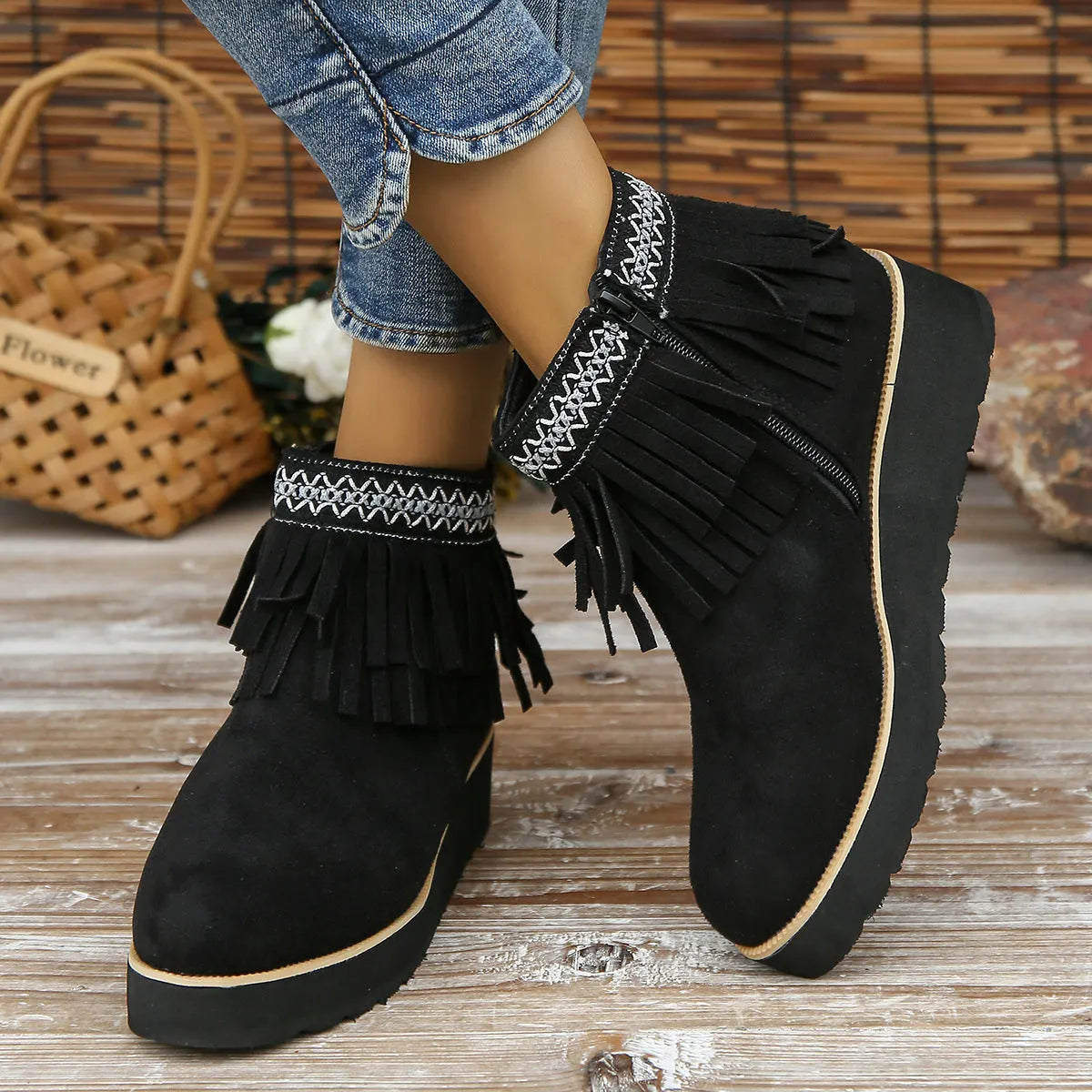 Women's dark brown suede wedge ankle boots with side zip and decorative tassel.