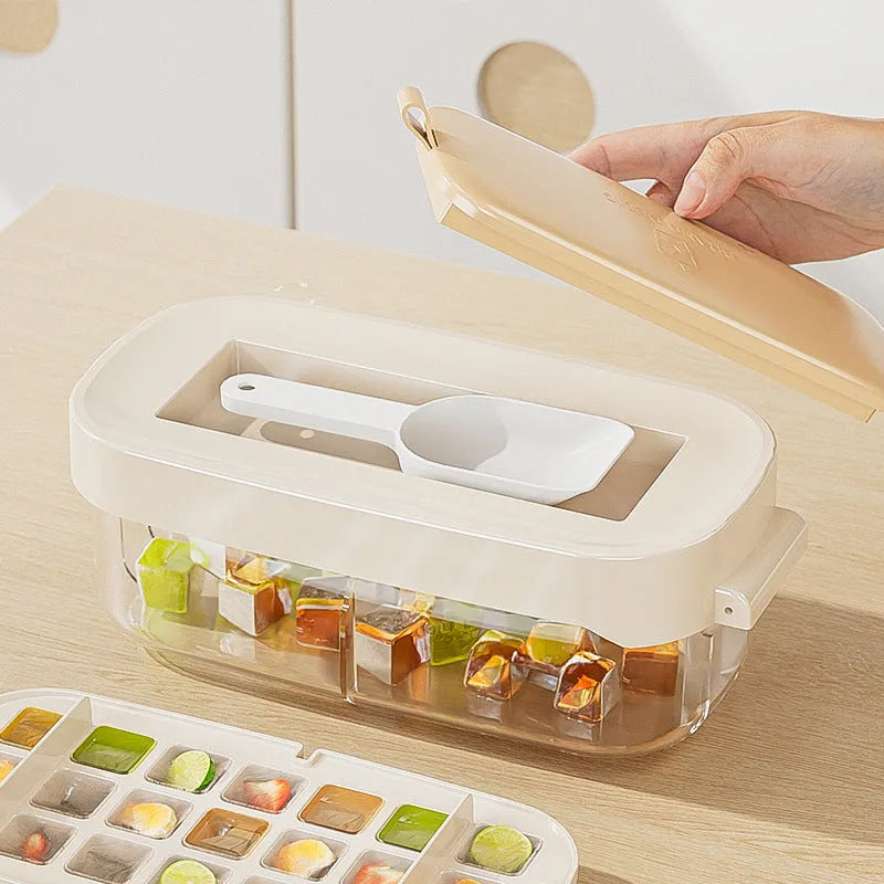 High capacity blue ice cube tray with ice grid and attached storage for the included shovel.