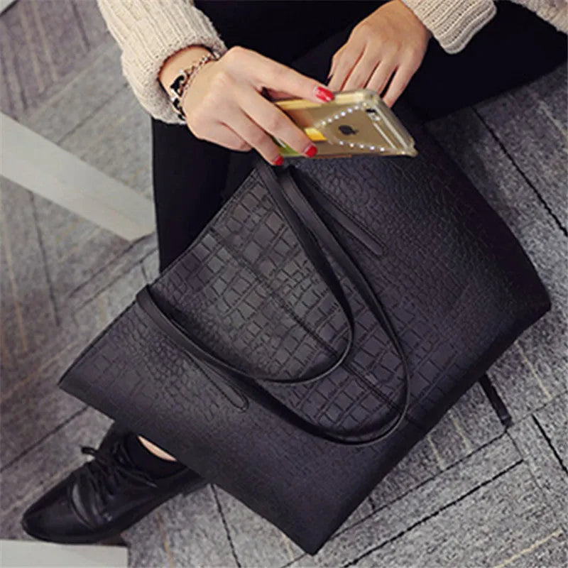 Simple fashion shoulder handbag in black and grey colours with adjustable strap