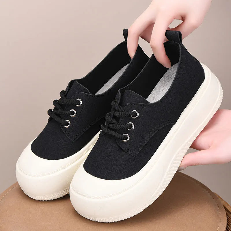 Women's beige suede platform loafers with round toe and front lace-up, on a white background.