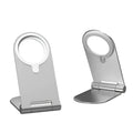 Silver vertical adjustable magnetic phone bracket on a desk, holding an iPhone 12.