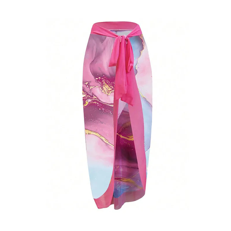 Pink one-piece printed sheath swimsuit for women with sun protection and matching skirt for beach or pool