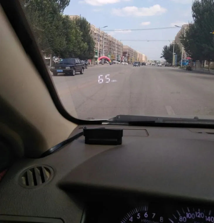 A100 OBD II head up display projecting vehicle speed on windscreen, with white or green light option