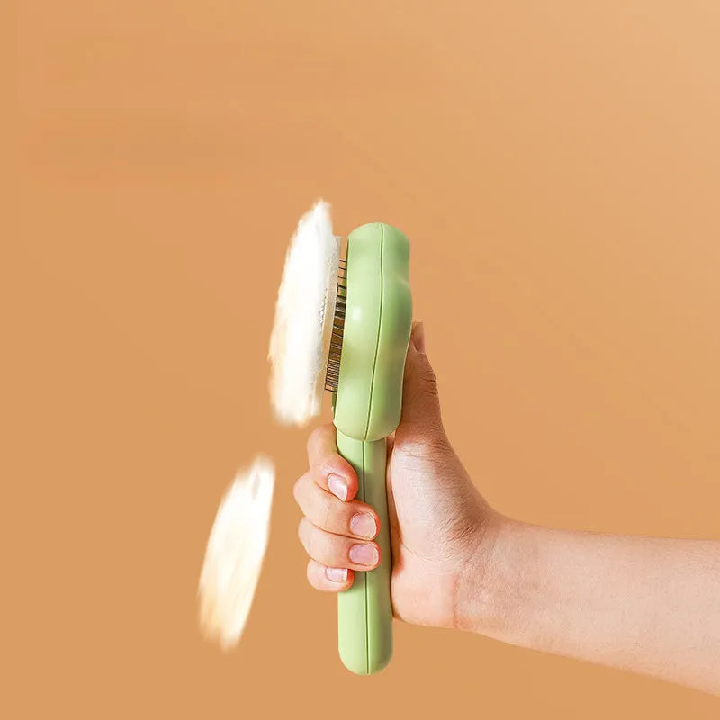 Green stainless steel cat grooming comb with self-cleaning mechanism and four rows of needles