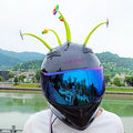 Yellow silicone sunflower decoration with suction cup for helmet customisation.