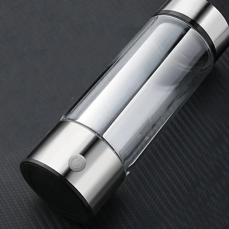 Portable hydrogen water cup with high borosilicate glass body and 304 stainless steel components, showing electrolysis bubbles.