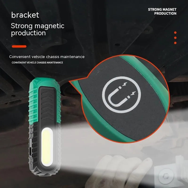 Black and green auto repair work light with PET coating for drop resistance