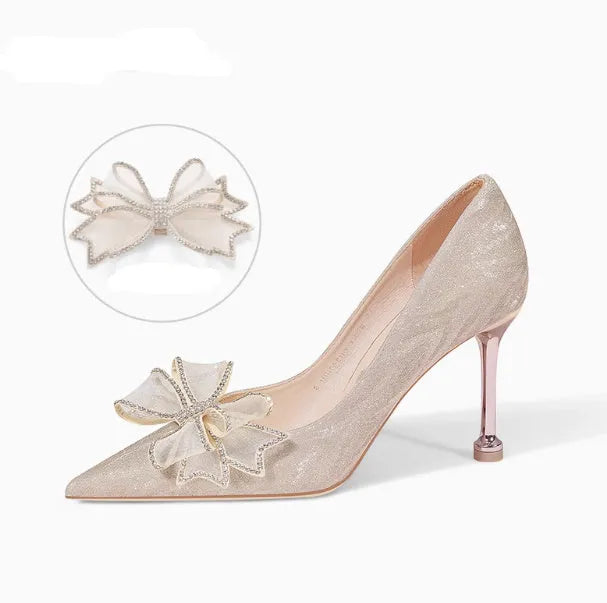 Women's champagne sequinned pointed toe stiletto high heels with a low cut, shown on a plain background.