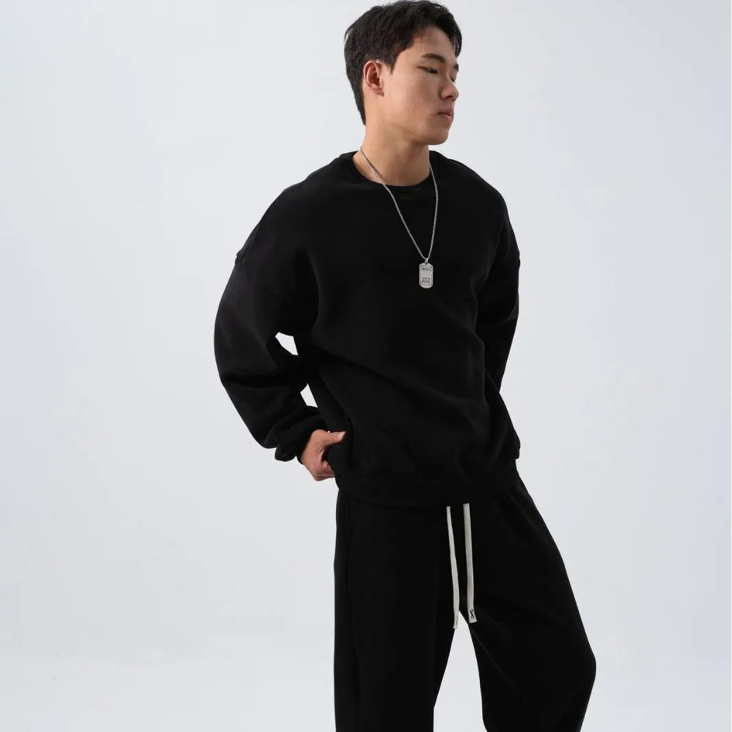 Men's polar fleece winter sports suit set showing crew neck coat and padded trousers in double-sided fleece fabric